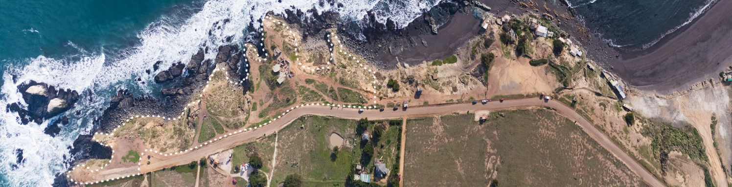 Pichilemu's regulatory plan was modified in 2016, with the incorporation of Zone E1, to preserve the surrounding area of Punta de Lobos. Thus, the cliffs and their vegetation are located inside Zone E1 Parque Comunal Punta de Lobos (green areas); with this, it limits the land use to the practice of sports associated with surfing (and other nautical sports), and establishes limitations to real estate development. Photo:  puntadelobos.org.